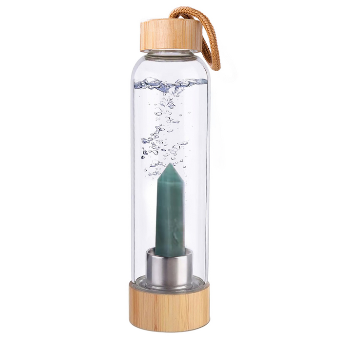 Botella de cristal con piedra energética