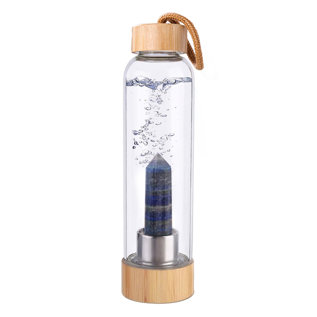 Botella de cristal con piedra energética