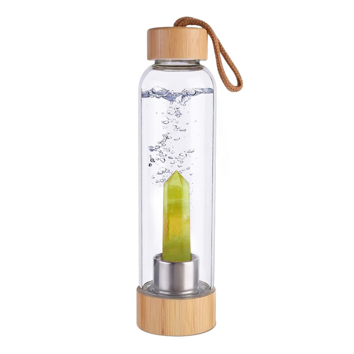 Botella de cristal con piedra energética