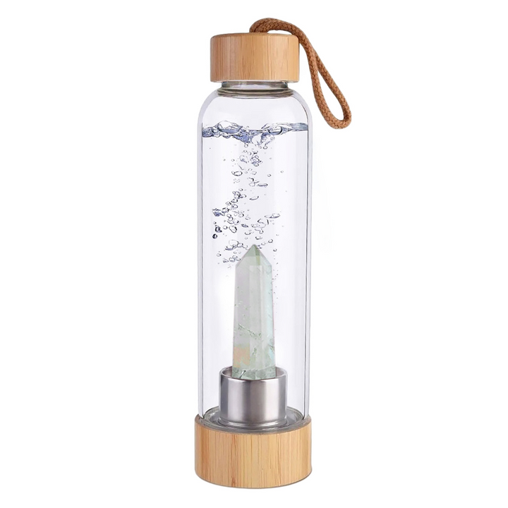 Botella de cristal con piedra energética