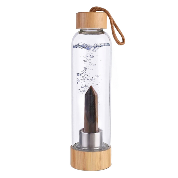 Botella de cristal con piedra energética