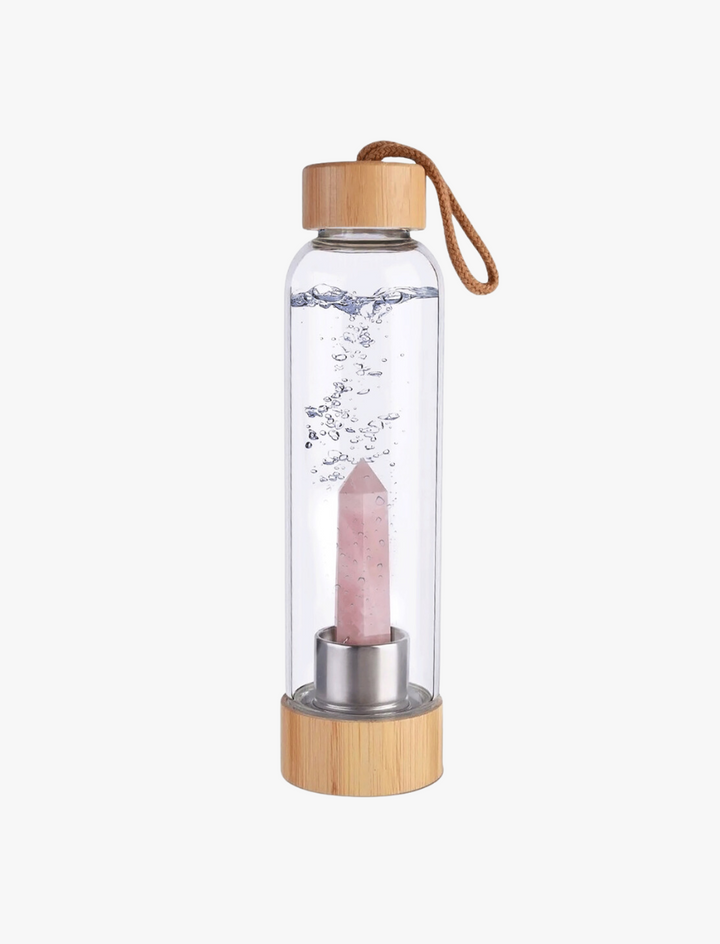 Botella de cristal con piedra energética