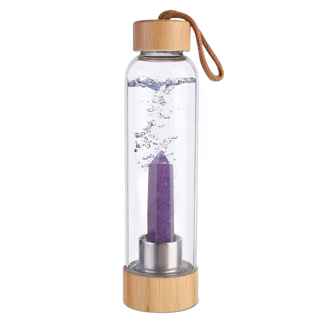 Botella de cristal con piedra energética